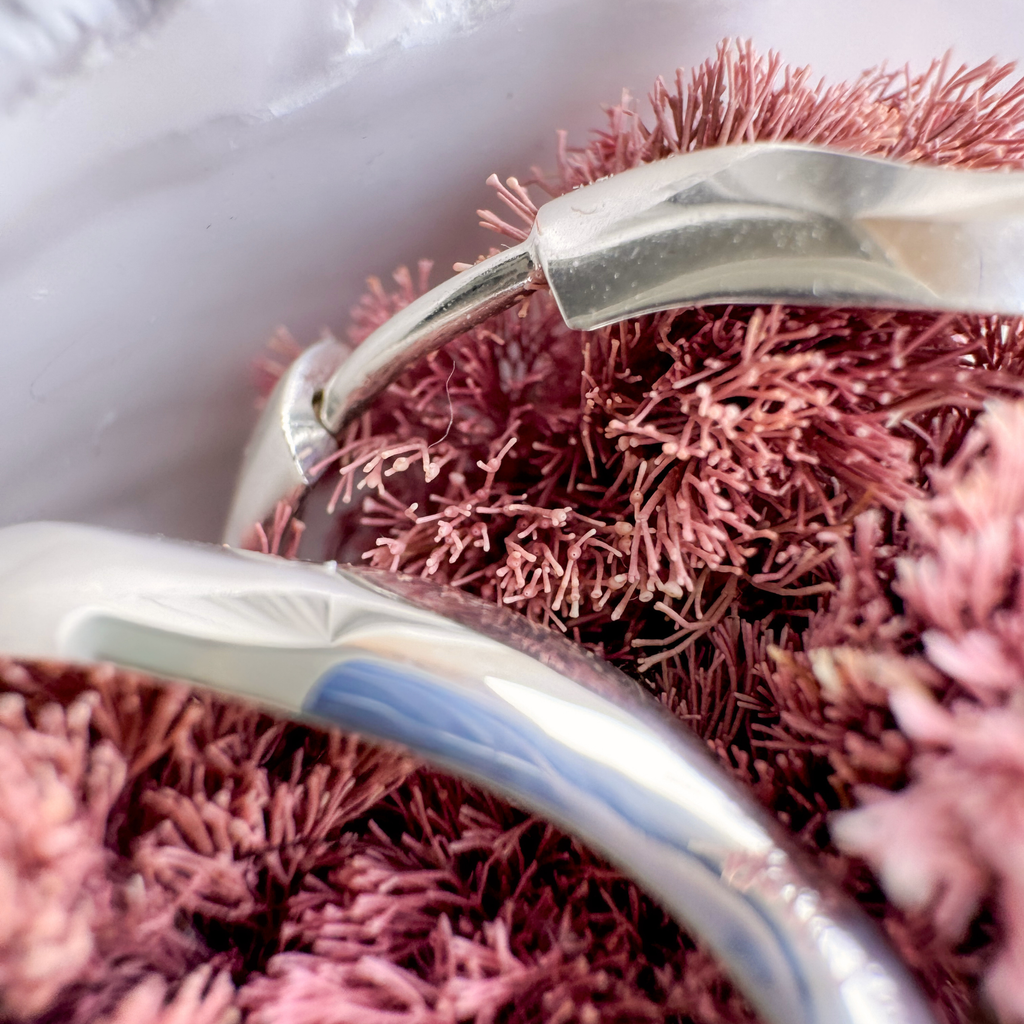 Silver Nesoi hoop earrings closeup with seaweed