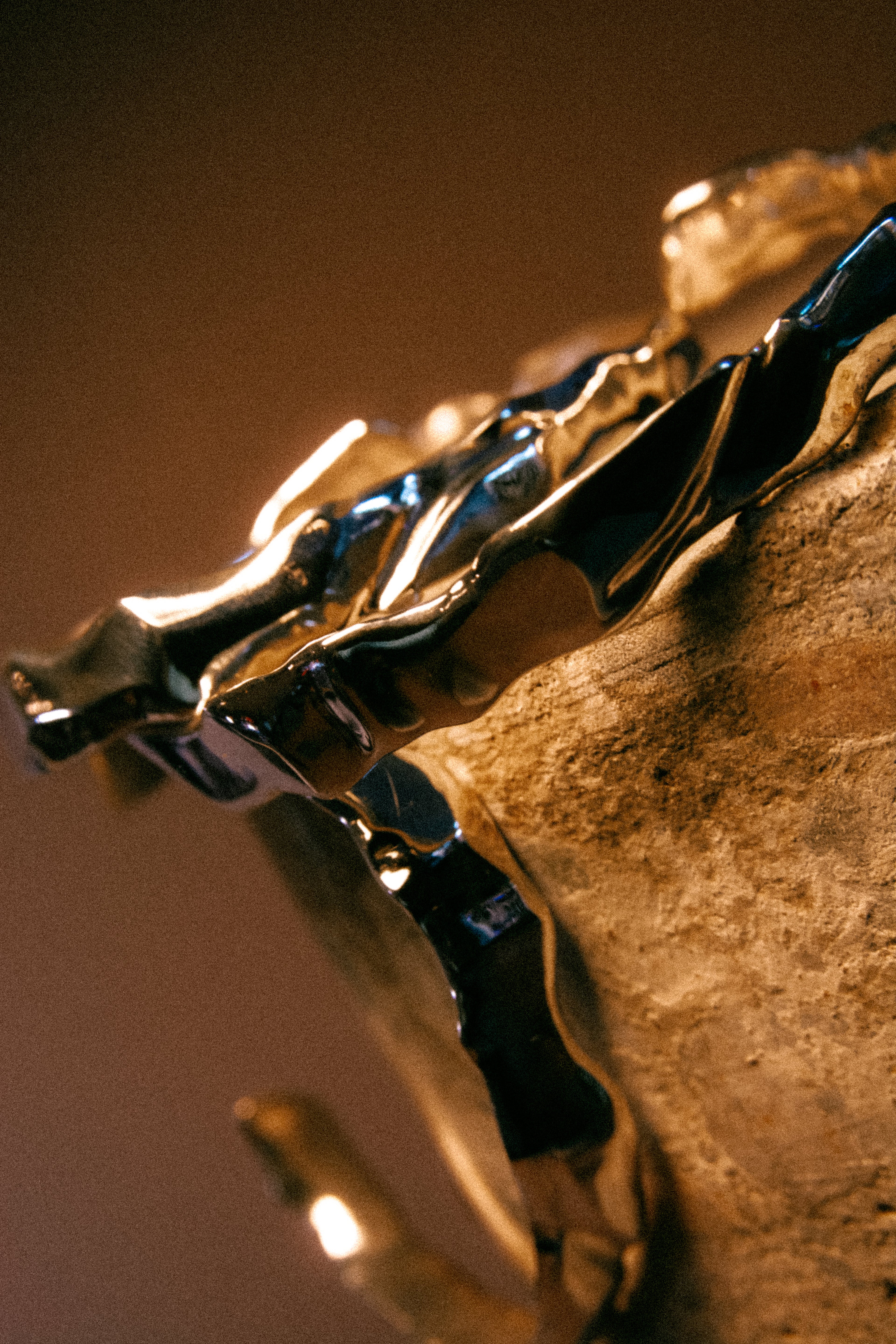 Silver Ourea cuff bracelet stack with a textured sculptural surface inspired by mountains and volcanic landscapes. 
