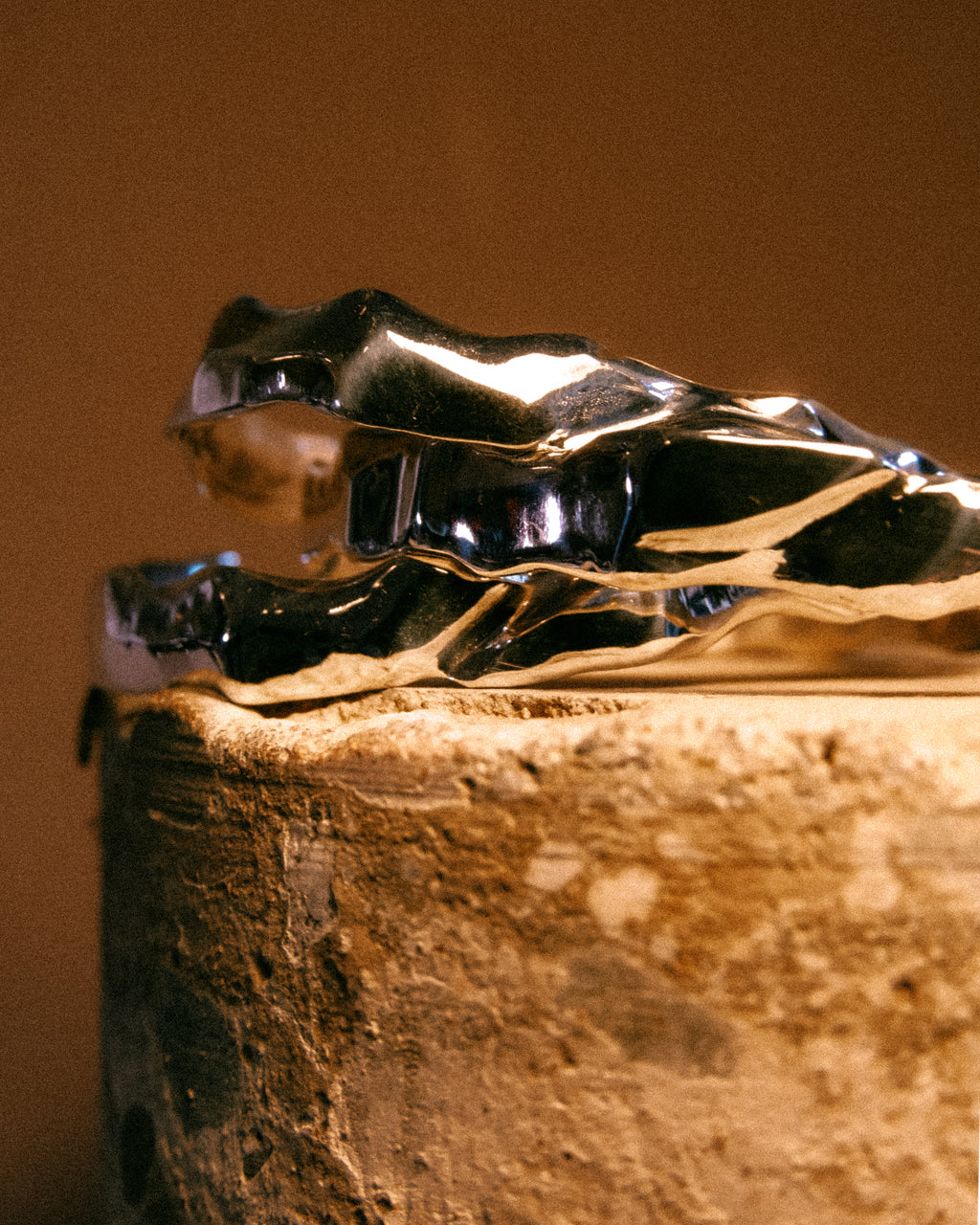 Silver Ourea cuff bracelet stack with a textured sculptural surface inspired by mountains and volcanic landscapes. 